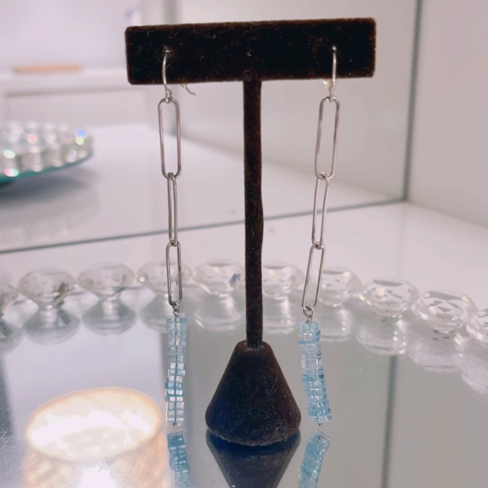 Made by hand with paper clips and aquamarine stone